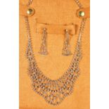 A VERY GOOD ART DECO DESIGN NECKLACE AND A PAIR OF DROP EARRINGS in a suede pouch.