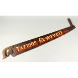 AN OLD SAW "TATTOOS REMOVED" with wooden handles. 3ft long.