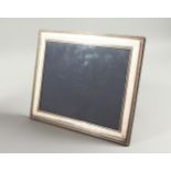 A LARGE .925 SILVER PHOTOGRAPH FRAME. 12.5ins x 10.5ins.