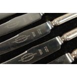 A SET OF SIX SILVER HANDLED TEA KNIVES in a case. Sheffield 1953.