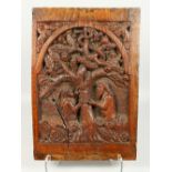 A 17TH / 18TH CENTURY FLEMISH OAK CARVED PANEL, depicting Adam and Eve beneath the apple tree in the