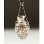 A TINY VICTORIAN ENGRAVED SILVER EGG SHAPED SCENT BOTTLE with screw top on a chainby SAMPSON &