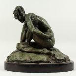 A GREEN BRONZE KNEELING NUDE FIGURE. 9ins high on a marble base.
