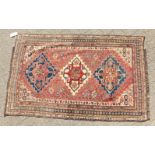 A VERY FINE ANTIQUE PERSIAN QASHQAI TRIBAL RUG, the centre with three motifs within an eleven row