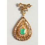 A VERY GOOD DIAMOND AND EMERALD DROP PENDANT.