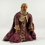 AN 18TH CENTURY ITALIAN CARVED WOOD DOLL FIGURE OF A MAN wearing a lace trimmed coat. 17ins high.