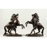 AFTER GUILLAUME COUSTOU (1677-1746) A PAIR OF MARLEY HORSES WITH ATTENDANTS, each on a