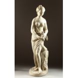 A SUPERB ITALIAN CARVED WHITE MARBLE STANDING SEMI-NUDE holding a dove, beside a plinth carved