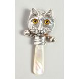 A NOVELTY SILVER AND MOTHER-OF-PEARL BABY'S RATTLE with a cat face.