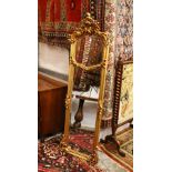 A LONG THIN CROSS FRAMED MIRROR. 5ft 8ins high x 1ft 6ins wide.