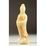A CHINESE CARVED JADE FIGURE OF GUANYIN. 9ins high.