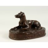 OUDIN, A SMALL FRENCH BRONZE OF A RECLINING DOG, STAMPED OUDIN, F. BARBEDIENNE FONDEUR, on an oval