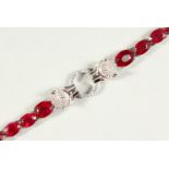 A SILVER RUBY SET PANTHER BRACELET, boxed.