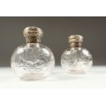 A SUPERB PAIR OF VICTORIAN STEVENS & WILLIAMS INTAGLIO CRYSTAL SCENT BOTTLES AND STOPPERS with