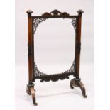 A VICTORIAN ROSEWOOD FRAMED FIRESCREEN with turned side columns (AF). 120cms high x 78cms wide.