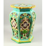A MINTON MAJOLICA GARDEN SEAT, of hexagonal shape, with pierced sides and incised with flowers (