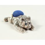 A NOVELTY SILVER BEAR PIN CUSHION. 5cms long.