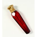A VICTORIAN FACET CUT RUBY TAPERING GLASS SCENT BOTTLE AND STOPPER with plain cap. 10cms long.