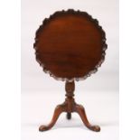 A CHIPPENDALE REVIVAL PIE CRUST TILT TOP TRIPOD TABLE, with "bird cage" support, carved baluster