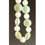 A JADE AND STONE NECKLACE.