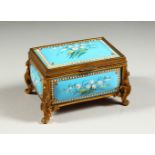 A GOOD 19TH CENTURY BLUE ENAMEL AND ORMOLU MOUNTED HINGED CASKET AND COVER, each panel painted
