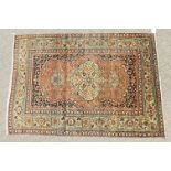 AN OLD PERSIAN TABRIZ RUG with large central motif and floral border. 6ft x 4ft 4ins.