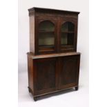 A GOOD 19TH CENTURY ANGLO INDIAN PADAUK WOOD CUPBOARD BOOKCASE, with floral carved cornice, a pair