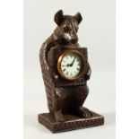 A GOOD BLACK FOREST TYPE WOOD BEAR CLOCK 30cms high.