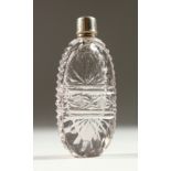 A GEORGIAN CUT GLASS SCENT BOTTLE with metal cap and glass stopper. 7.5cms long.