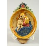A SMALL PRATTWARE OVAL PLAQUE, Madonna and Child. 7ins x 4.5ins.