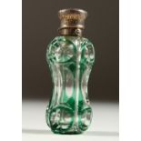 A GOOD VICTORIAN GREEN TINTED GLASS SCENT BOTTLE with engraved silver top. 9cms long.