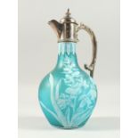 A SUPERB BLUE CAMEO GLASS CLARET JUG with silver handle, mounts and lid, the body with cameo