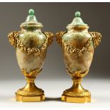 A SUPERB PAIR OF REGENCY FELDSPAR URN SHAPED VASES in the manner of MATTHEW BOULTON with masks and