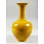 A CHINESE YELLOW GROUND PORCELAIN BOTTLE VASE. Six character mark in blue. 10ins high.