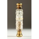 A GOOD VICTORIAN DOUBLE ENDED CUT GLASS SCENT BOTTLE with silver gilt mounts. London 1876. Maker