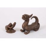 TWO GOOD MINIATURE CHINESE BRONZE FIGURES OF A DRAGON DOG AND TOAD, the dragon dog in a recumbent