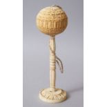 A FINE 18TH - 19TH CENTURY INDIAN OR SRI LANKEN CARVED IVORY BALL AND STAND.