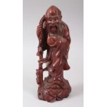 A LATE 19TH CENTURY CHINESE CARVED HARDWOOD FIGURE OF SHOU LOU, holding his staff and a gourd,