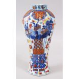 AN 18TH CENTURY CHINESE QIANLONG CLOBBERED PORCELAIN VASE, of quatrefoil section. 21cms high.