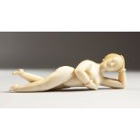 A GOOD 19TH CENTURY CHINESE CARVED IVORY MEDICINE DOLL. 5ins long.