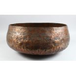 A LARGE 15TH CENTURY MAMLUK COPPER BOWL EYGPT OR SYRIA with engraved band, 37cm diameter.