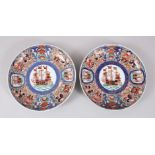 A PAIR OF LATE MEIJI PERIOD JAPANESE PORCELAIN IMARI PLATES, decorated with ships and figures, 17.