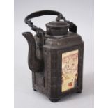 A CHINESE SOFT METAL TEA KETTLE, with four panels containing different landscape scenes, 20.3cm high