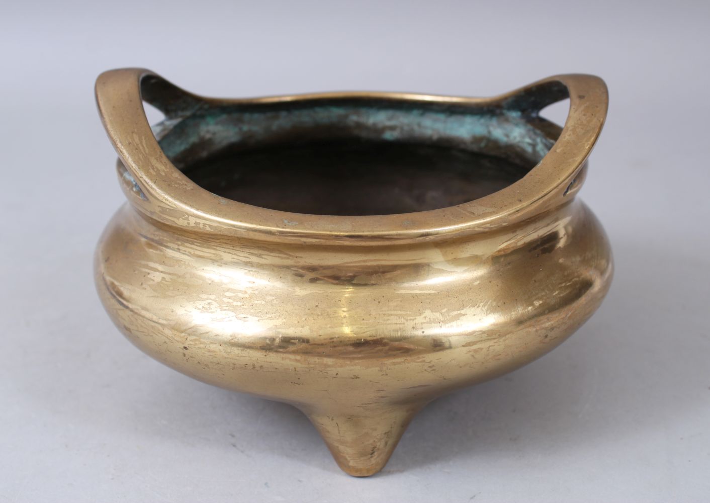 A 19TH CENTURY CHINESE BRONZE CIRCULAR CENSER with large seal mark, 17cm diameter.