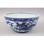 A CHINESE BLUE AND WHITE PORCELAIN DRAGON BOWL, the interior centre with a six-character Xuande