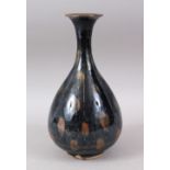 A CHINESE JIAN WARE POTTERY VASE, the dark ground with green/brown highlights, 27cm high