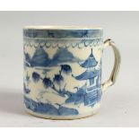 A CHINESE BLUE AND WHITE MUG with a lake scene. 3.5ins high.