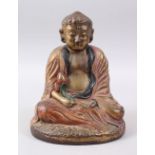 A CHINESE BRONZE / METAL FIGURE OF A SEATED BUDDHA / DEITY, in the seated position holding a flower,