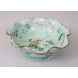 A 19TH CENTURY CHINESE CELADON FAMILLE ROSE PORCELAIN BOWL, the dish decorated with floral