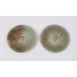 A PAIR OF CHINESE JADE / JADELIKE PENDANTS / BUTTONS, carved decoration, 5.5cm diameter